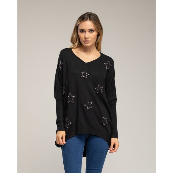 Oversized lange gebreide trui met opgetikte stoffen sterren met strass.