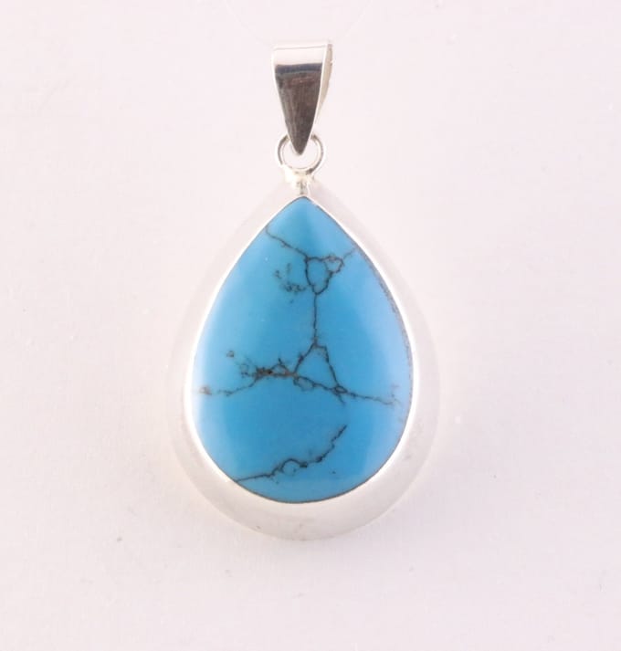 Druppelvormige zilveren hanger met blauwe turkoois