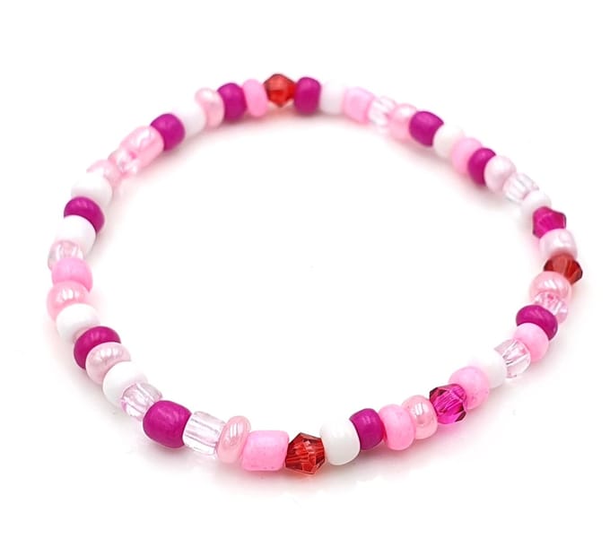 Kinderarmbandje met 4mm roze glaskraaltjes - lengte 16 cm