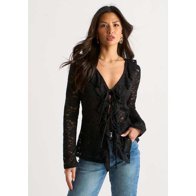 Zwarte jersey blouse met ruches en strik aan de voorkant