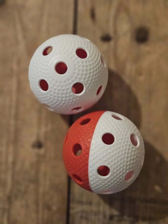 Necy Bullet floorball ballen - wit / rood - 2stuks