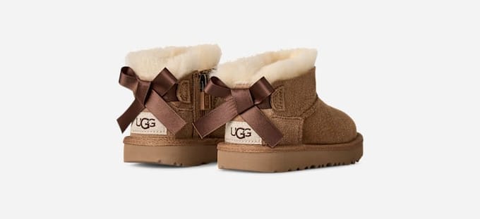 UGG® Ultra Mini Bailey Bow Boot in Brown, Size 5, Polyester/Wool