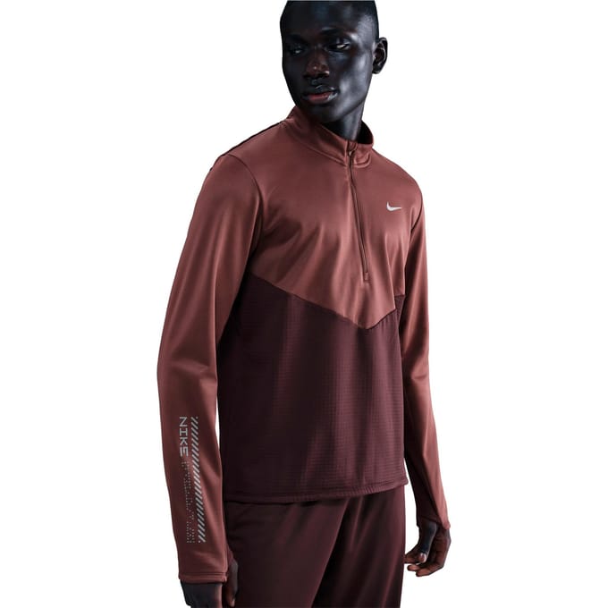 Nike pacer therma-fit winterized ziptop in de kleur rood.