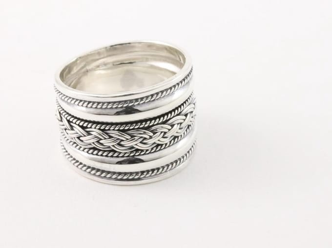 Brede zilveren ring met vlechtmotief en kabelpatronen - maat 17