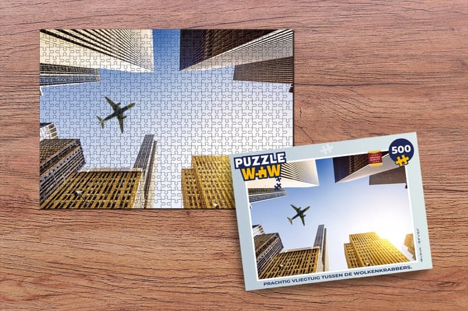 Puzzel Vliegtuig tussen de wolkenkrabbers - Legpuzzel - Puzzel 500 stukjes