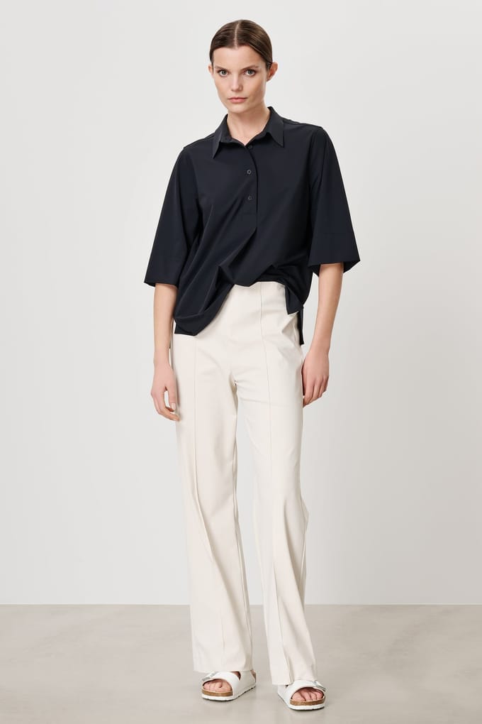 TRVL DRSS Arles Polo Top Black Maat: S | Pantalons Outlet | Dames | Wit