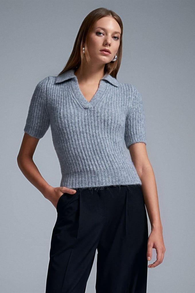 Vrouwen Aansluitende Geribbelde Polo Sweater