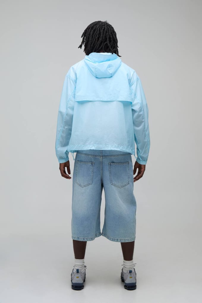 Oversized Boxy Glow In The Dark Transparante Cagoule Met Capuchon En Togglesluiting | Blue | Size Small