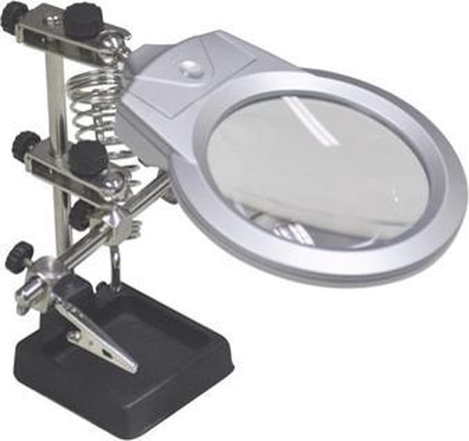 Derde hand met loeplamp voor solderen met vergrootglas