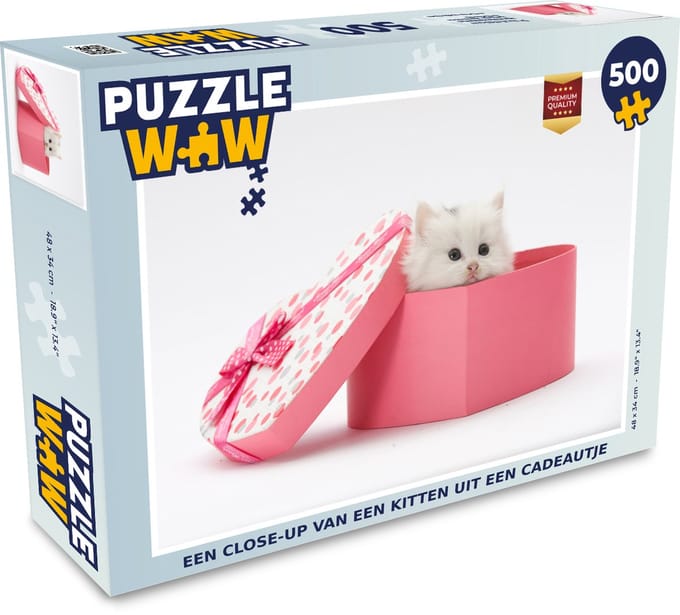 Puzzel Een close-up van een kitten uit een cadeautje - Legpuzzel - Puzzel 500 stukjes