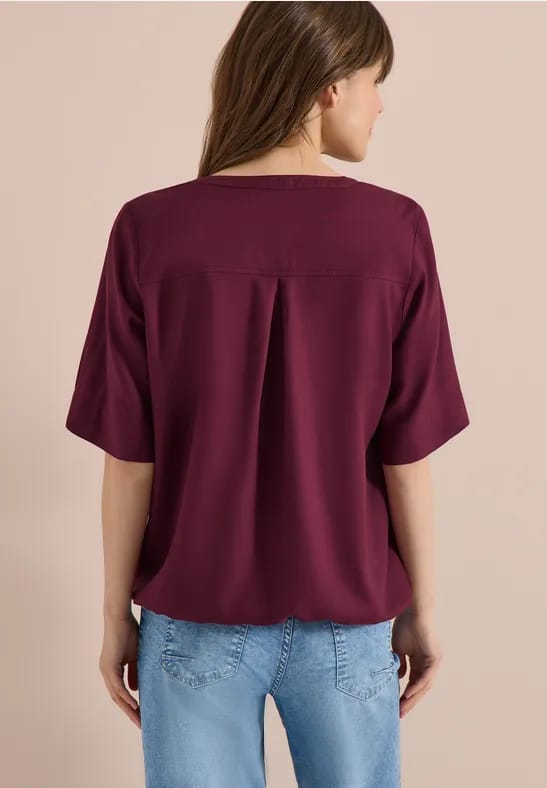 Blouse met gespleten hals en elastische zoom