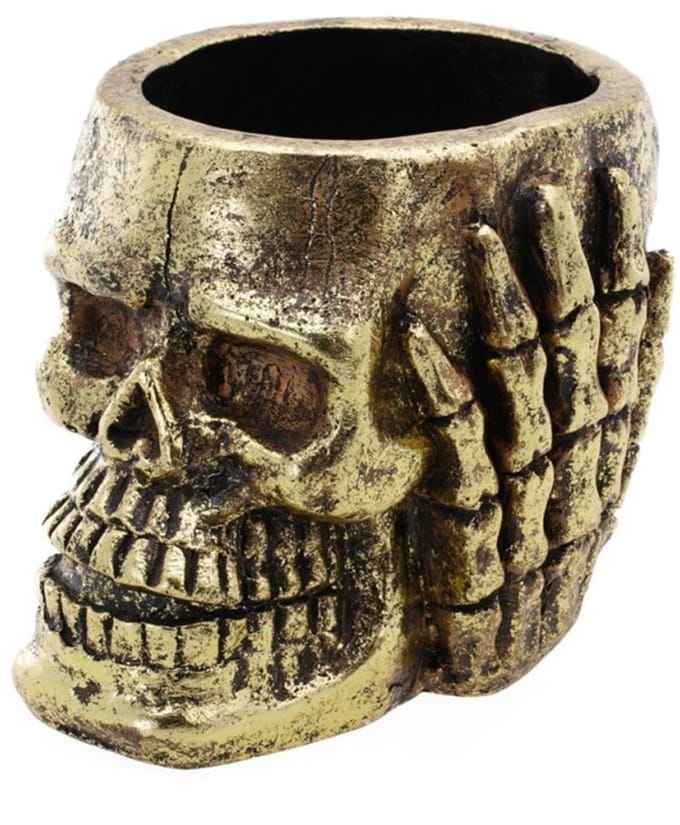 Pot met goudkleurige doodskop