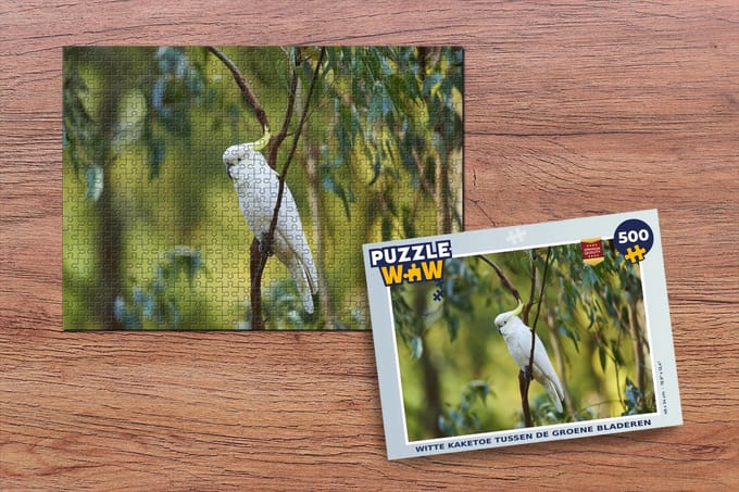 Puzzel Witte kaketoe tussen de groene bladeren - Legpuzzel - Puzzel 500 stukjes