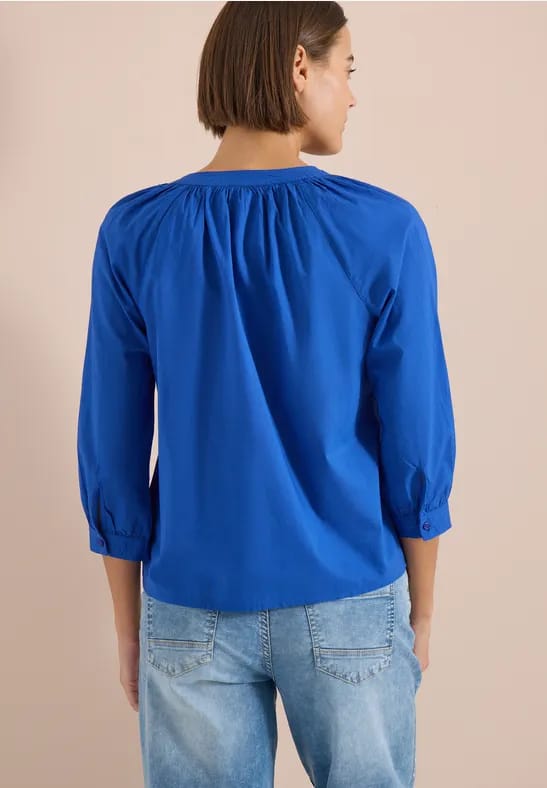 Blouse met 3/4 mouwen en gespleten hals in effen kleur