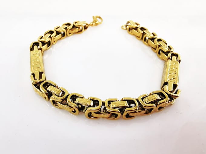 RVS - Heren - Koningsschakel - goudkleurig - design - Armband L 24 cm - Br 6 mm.