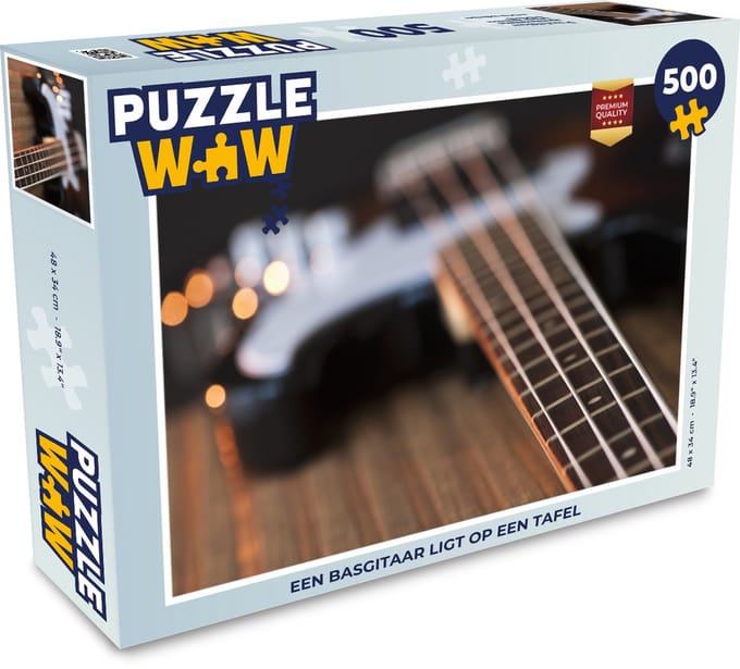Puzzel Een basgitaar ligt op een tafel - Legpuzzel - Puzzel 500 stukjes