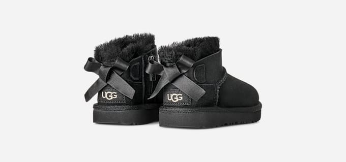 UGG® Ultra Mini Bailey Bow Boot in Black, Size 6, Polyester/Wool