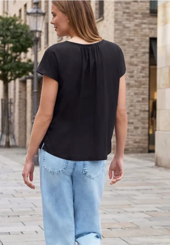 Blouse met hangende schouder en linten