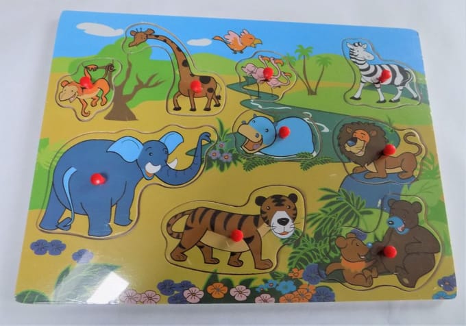 Houten puzzel met knopjes  Dieren