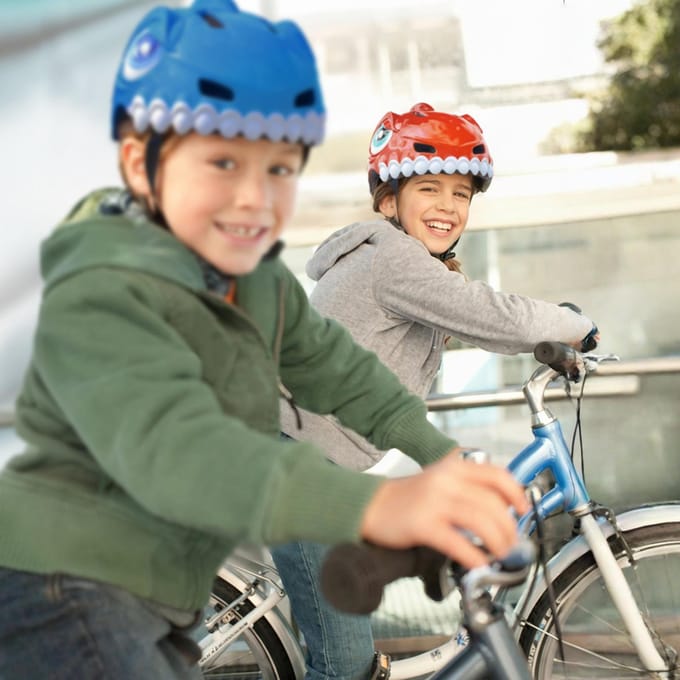Wozinsky Children's bicycle helmet dinosaur motif 52-56 cm - red