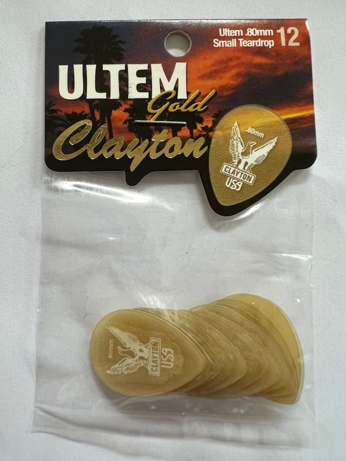 Clayton - Ultem Gold - small teardrop plectrum - 0.80 mm - 12-pack