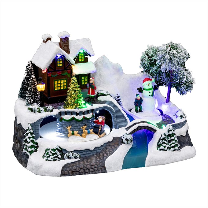 Feeric Lights & Christmas - Kerstdorp tafereel - kerstman slee - led licht - 24 cm