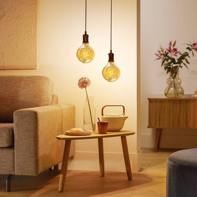 Philips LED-bolvormige lamp E27 G95 3,1 W goud 1.800 K dimbaar