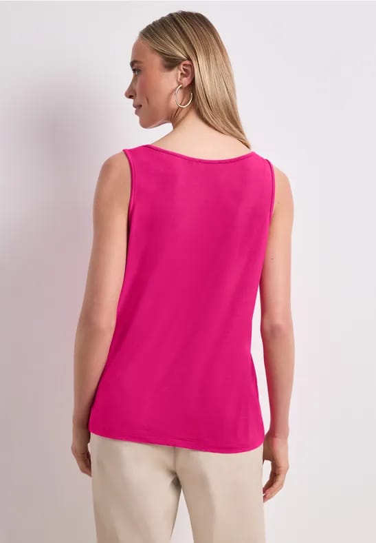 Top met V-hals en knoopdetail
