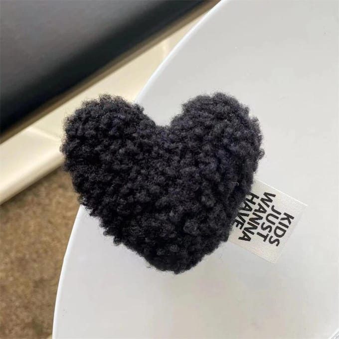 Peluche coréenne mignonne, chaleureuse, pelucheuse et attentionnée. noir