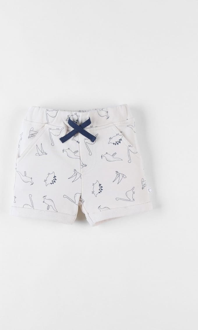 Noukie's - Jongens - Bermuda short - Vanille met blauwe dino print - 18 maand 86