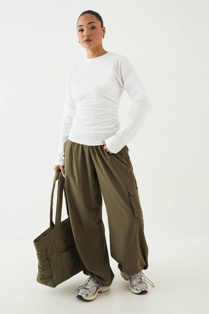 Dames DSGN Studio Top met Gerimpelde Zijkant en Lange Mouwen | Wit | Maat: Small