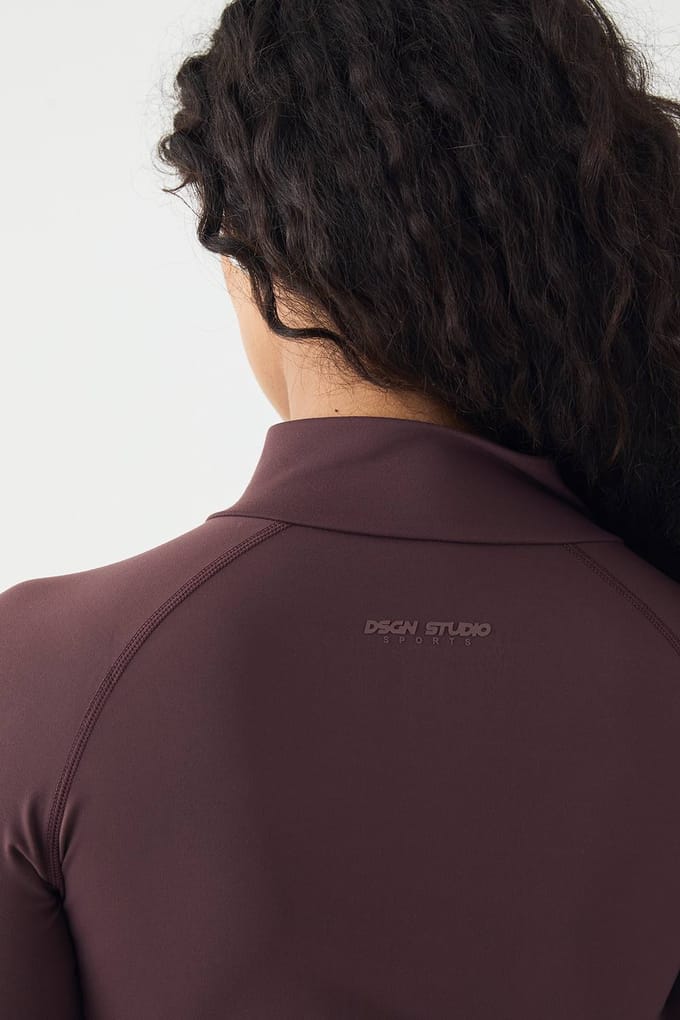 Dames DSGN Studio Sports Ultra Sculpt Ritsjack | Chocoladebruin | Maat: Medium