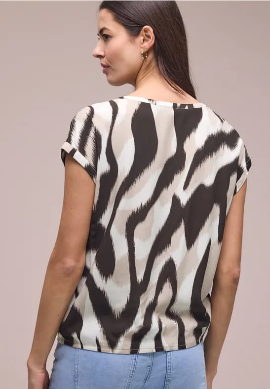 Blouse met overhangende schouders en getapete details