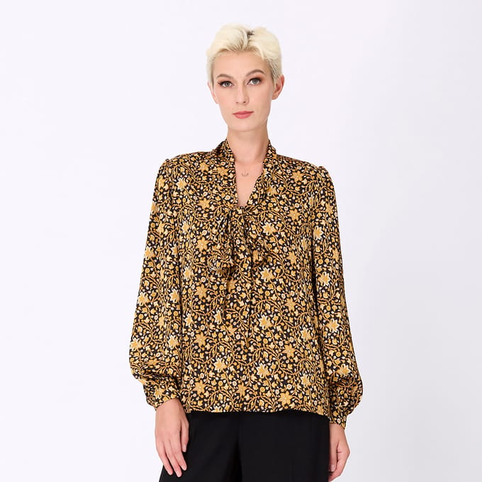 Ascot-tie blouse en kunst-deco print