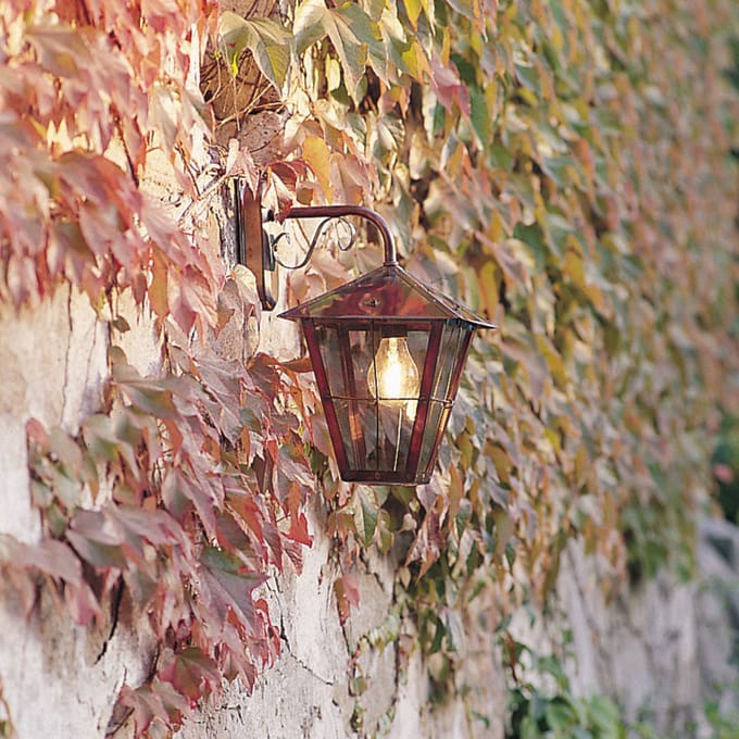 Konstsmide Buitenwandlamp Fenix in koper, hangend