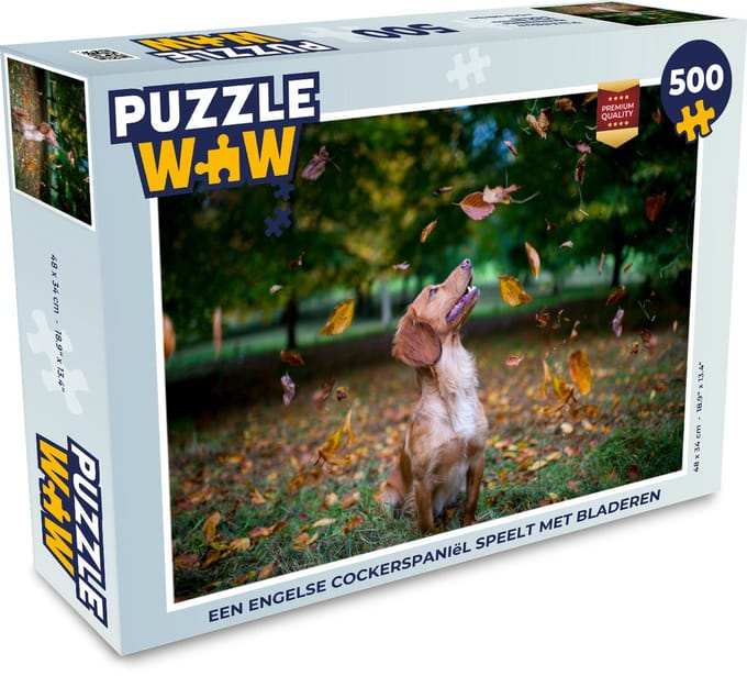 Puzzel Een Engelse cockerspaniël speelt met bladeren - Legpuzzel - Puzzel 500 stukjes