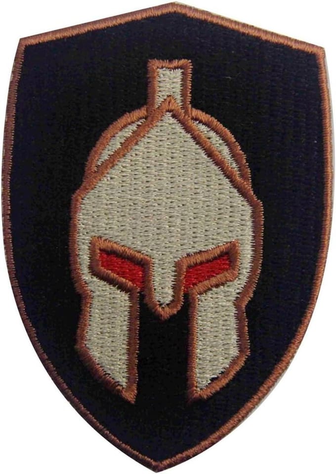 Sew-on, embroidered, design: Spartan fighting helmet, for ironing on or sewing.