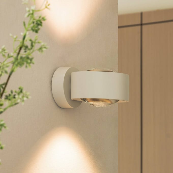 Arcchio LED wandlamp Rotari, lens, omhoog/omlaag, wit, metaal