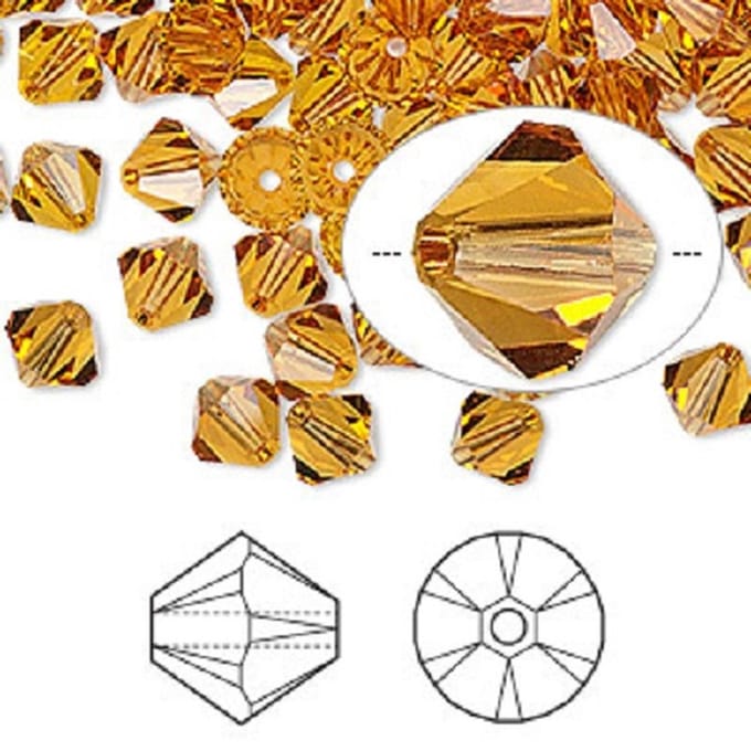 Swarovski Elements, Xilion Bicone (5328), 10mm, topaz. Per 12 stuks