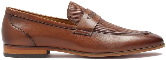 Brown loafers decorated with leather embossing