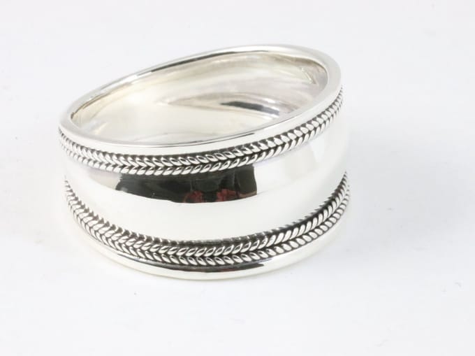 Brede hoogglans zilveren ring met kabelpatronen - maat 21