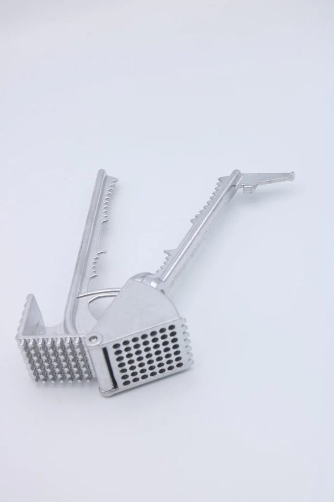 Multi functionele knoflook pers