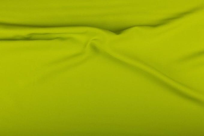 Texture/Polyester stof - Limoengroen - 25 meter