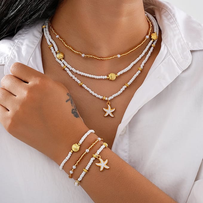 Jomide Sieradenset - Kettingen/Armbandjes - Boho Shell - Wit/Goudkleurig