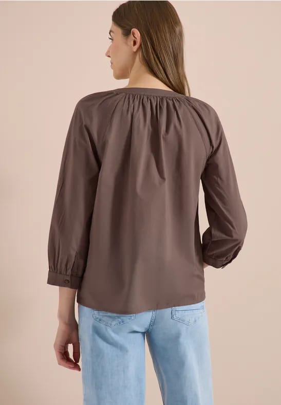 Blouse met 3/4 mouwen en gespleten hals in effen kleur