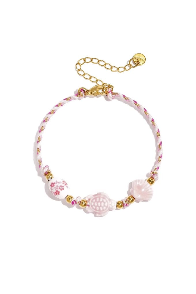 Armband met schildpad en schelp kralen en touwmotief Roze