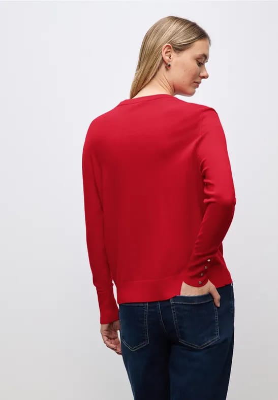 Trui met knoopdetail