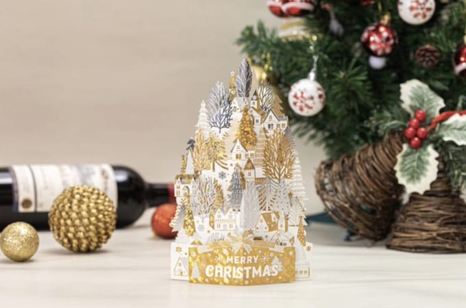 3D Pop up kerstkaart goud witte huizen op een sneeuwheuvel