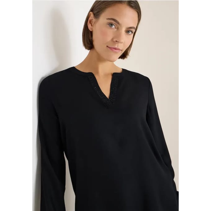 Blouse met glitterdetails