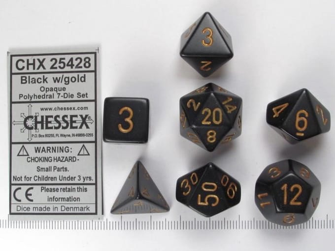 Chessex Opaque Zwart goud Polydice Dobbelsteen Set 7 stuks.